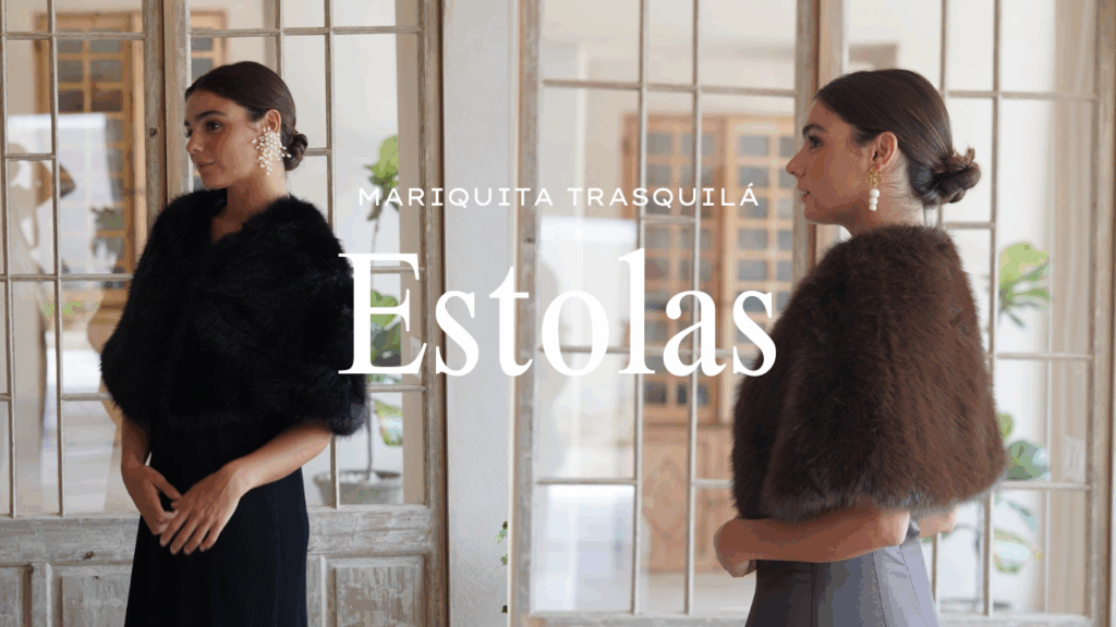 Invitada elegante con estola de pelo sintético en tonos neutros, combinada con vestido largo para boda de otoño-invierno 2025/26. La estola aporta calidez, textura y un toque de lujo sofisticado al look de invitada.